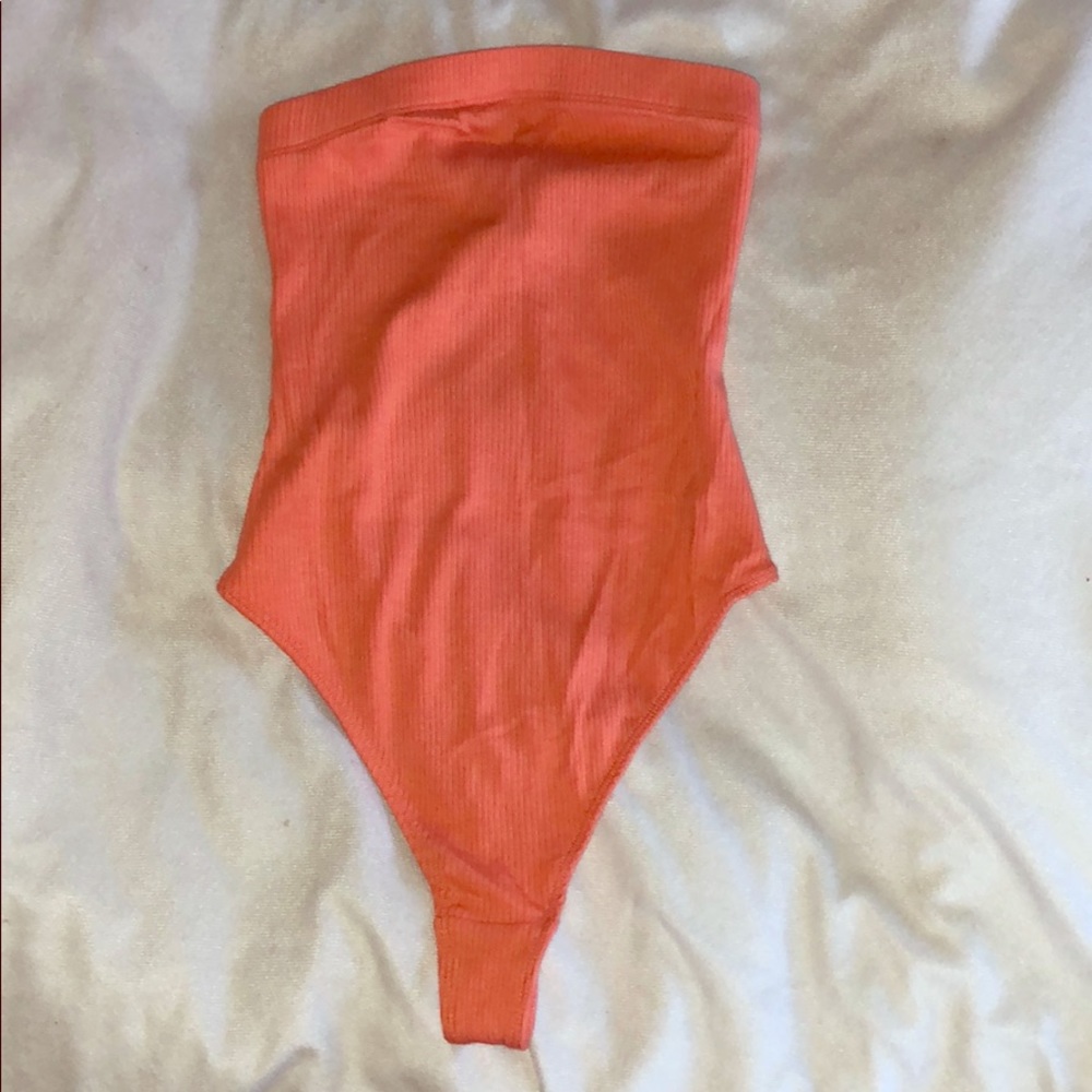 Orange out from under strapless bodysuit. Size XS